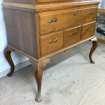 Sale Photo Thumbnail #305: This highboy is 2 piece's, made of a mix of cherry and pine; cabriole legs with fluted snake feet; on the very top center drawer it has inlay with the initials "I & B"; total of 11 drawers that are dovetail jointed, with a mixture of different brass pulls