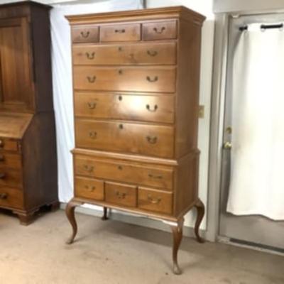 Sale Photo Thumbnail #299: This highboy is 2 piece's, made of a mix of cherry and pine; cabriole legs with fluted snake feet; on the very top center drawer it has inlay with the initials "I & B"; total of 11 drawers that are dovetail jointed, with a mixture of different brass pulls