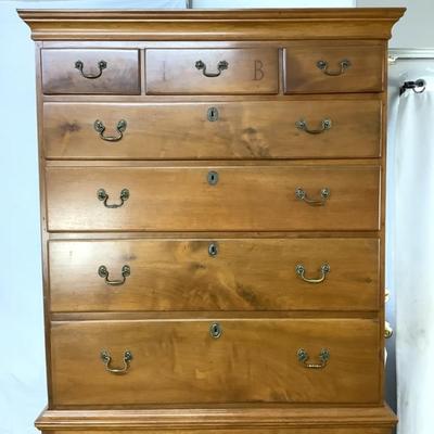 Sale Photo Thumbnail #301: This highboy is 2 piece's, made of a mix of cherry and pine; cabriole legs with fluted snake feet; on the very top center drawer it has inlay with the initials "I & B"; total of 11 drawers that are dovetail jointed, with a mixture of different brass pulls