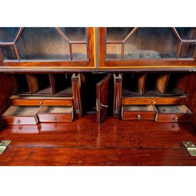 Sale Photo Thumbnail #319: George III Style English Bureau-Bookcase in Mahogany of Rich Color and Patina with Overall Satinwood Banding. The slant front displays beautifully flamed mahogany and opens to reveal a fitted interior with two document drawers and six pigeon holes over si