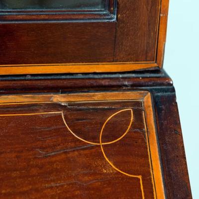 Sale Photo Thumbnail #323: George III Style English Bureau-Bookcase in Mahogany of Rich Color and Patina with Overall Satinwood Banding. The slant front displays beautifully flamed mahogany and opens to reveal a fitted interior with two document drawers and six pigeon holes over si