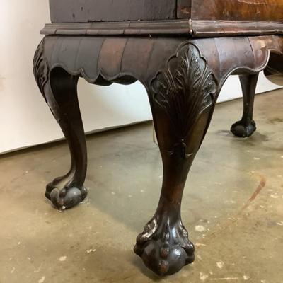 Sale Photo Thumbnail #331: 18th or early 19th century Continental vitrine, applied shell frieze at the top, arched mullions over glass, with compass inlay on the veneered bottom half, scalloped base, claw on ball feet. It has a built in light switch that plugs into the wall and it 