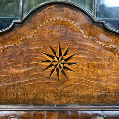 Sale Photo Thumbnail #336: 18th or early 19th century Continental vitrine, applied shell frieze at the top, arched mullions over glass, with compass inlay on the veneered bottom half, scalloped base, claw on ball feet. It has a built in light switch that plugs into the wall and it 