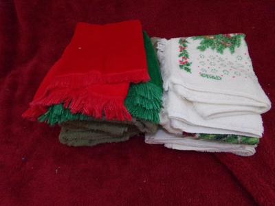 A whole pile of kitchen towels, hot pads, etc. quite the assortment.