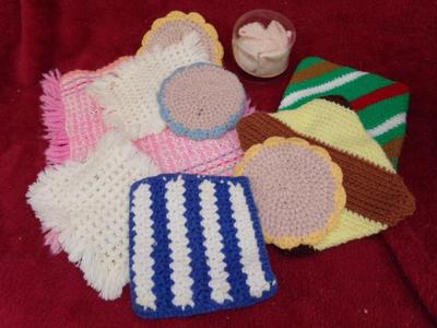 A whole pile of kitchen towels, hot pads, etc. quite the assortment.
