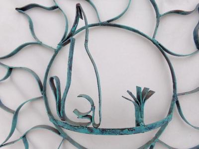Garden fence ornament. Colored metal, about 22" diameter.