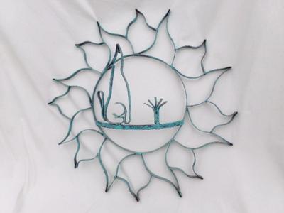 Garden fence ornament. Colored metal, about 22" diameter.