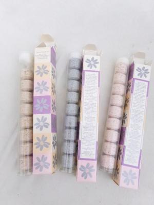 Three packages of “Bath Fizz Balls”, assorted scents.