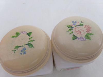 pair Avon “Country Garden” powder sachets. Milk glass w/lift off caps, about 3-1/4" tall.