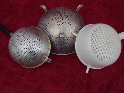 THREE colanders, assorted size & style. Good.