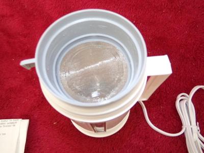 AUTO COFFEE MAKER & soup warmer. Plugs in to the cigar lighter