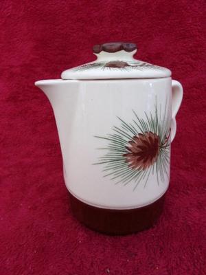Classic ceramic pitcher w/lid, hand painted & glazed. About 8" tall.