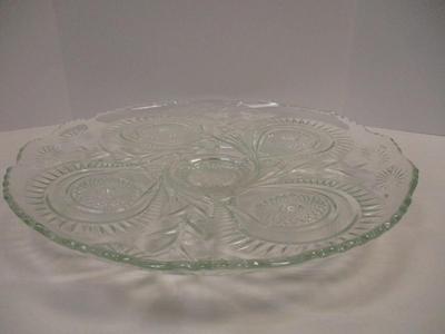 Sale Photo Thumbnail #400: The product is an antique EAPG (Early American Pattern Glass) punch bowl and underplate made by the U.S. Glass Co. The intricate design features a slanted horseshoe and radial daisy pattern, adding a touch of elegance to any dining or kitchen decor. The g