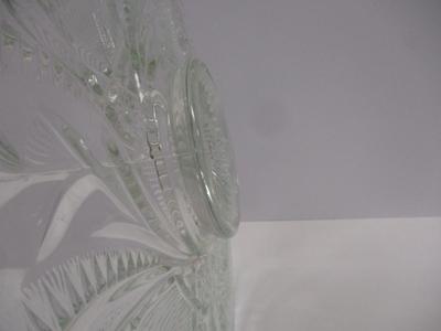 Sale Photo Thumbnail #402: The product is an antique EAPG (Early American Pattern Glass) punch bowl and underplate made by the U.S. Glass Co. The intricate design features a slanted horseshoe and radial daisy pattern, adding a touch of elegance to any dining or kitchen decor. The g