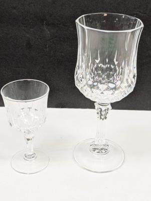 Sale Photo Thumbnail #255: 4 - 6 1/2" and 6 - 4"

The Mid 20th Century Cristal D'Arques Longehamp Wine Glasses are a set of elegant wine glasses from the Century product line. These wine glasses showcase the classic and timeless design popular in the mid-20th century, adding a touc