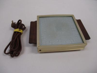 Sale Photo Thumbnail #1928: The Vintage Mid Century Salton Hotray Automatic Food Warmer is a small kitchen appliance that is perfect for keeping food warm during meals or gatherings. With its retro design and automatic food warming capabilities, this Salton brand product is both fun