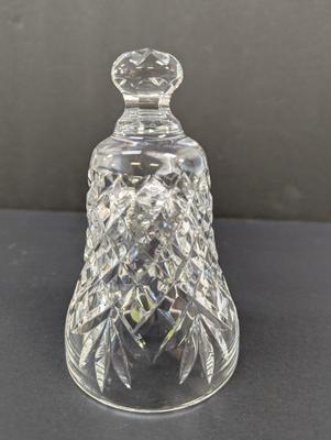 Sale Photo Thumbnail #319: The Waterford Crystal Collectors 1990 Bell features a theme of bells with a unique design of seven swans swimming. Made of high-quality crystal, this collectible item captures the essence of the 12 Days of Christmas. With its intricate details and timeles