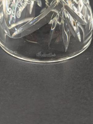Sale Photo Thumbnail #320: The Waterford Crystal Collectors 1990 Bell features a theme of bells with a unique design of seven swans swimming. Made of high-quality crystal, this collectible item captures the essence of the 12 Days of Christmas. With its intricate details and timeles