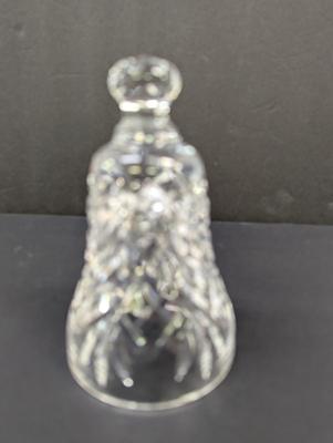 Sale Photo Thumbnail #318: The Waterford Crystal Collectors 1990 Bell features a theme of bells with a unique design of seven swans swimming. Made of high-quality crystal, this collectible item captures the essence of the 12 Days of Christmas. With its intricate details and timeles