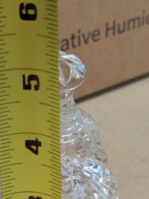 Sale Photo Thumbnail #325: The Waterford Crystal Collectors 1989 Bell features a beautifully crafted design of 6 geese a laying, part of the famous 12 days of Christmas theme. Made from the finest crystal, this bell captures the essence of Christmas with its intricate detailing and