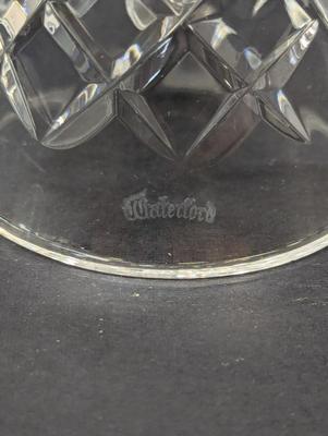 Sale Photo Thumbnail #328: The Waterford Crystal Collectors 1993 Bell features a festive design inspired by the 12 Days of Christmas, with 10 Lords leaping. Made of high-quality crystal, this decorative bell captures the essence of the holiday season with its intricate details and 