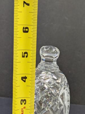 Sale Photo Thumbnail #329: The Waterford Crystal Collectors 1993 Bell features a festive design inspired by the 12 Days of Christmas, with 10 Lords leaping. Made of high-quality crystal, this decorative bell captures the essence of the holiday season with its intricate details and 