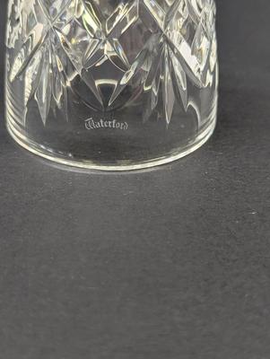 Sale Photo Thumbnail #332: The Waterford Crystal Collectors 1995 Bell is a beautifully crafted decorative piece featuring 12 drummers drumming on Christmas Day. Made of high-quality crystal, this bell captures the festive spirit of the holiday season. With its intricate design and 