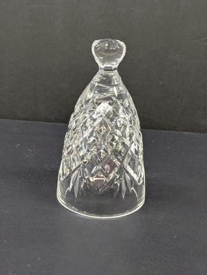 Sale Photo Thumbnail #333: The Waterford Crystal Collectors 1995 Bell is a beautifully crafted decorative piece featuring 12 drummers drumming on Christmas Day. Made of high-quality crystal, this bell captures the festive spirit of the holiday season. With its intricate design and 