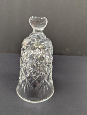 Sale Photo Thumbnail #337: The Waterford Crystal Collectors 1994 Bell is a beautifully crafted Christmas-themed bell made of crystal. With a classic Christmas theme of 12 days of Christmas and 11 pipers piping, this bell is a perfect addition to any collector's display. The intrica