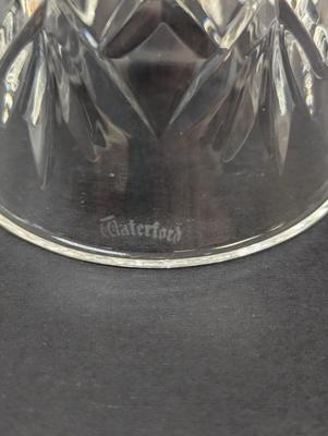 Sale Photo Thumbnail #339: The Waterford Crystal Collectors 1994 Bell is a beautifully crafted Christmas-themed bell made of crystal. With a classic Christmas theme of 12 days of Christmas and 11 pipers piping, this bell is a perfect addition to any collector's display. The intrica