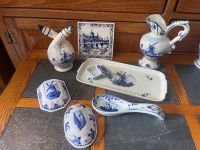 Sale Photo Thumbnail #798: Various Porcelain Pieces with Dutch Theme (Lot of 8). Oil/Vinegar holder, pitcher, platter, and a few wall decorations.