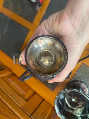 Sale Photo Thumbnail #914: Hand Engraved Silver Plate Copper Pieces Plus More (Lot of 6). Also includes a glass serving bowl and two serving spoons.