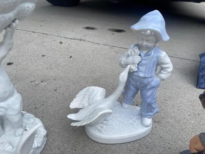 Sale Photo Thumbnail #922: Anatomically Incorrect Statuettes (Lot of 8). Wall mounted wolf, several porcelain cherubs, biker bobblehead, and an eagle.