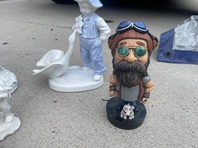Sale Photo Thumbnail #923: Anatomically Incorrect Statuettes (Lot of 8). Wall mounted wolf, several porcelain cherubs, biker bobblehead, and an eagle.