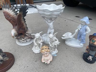 Sale Photo Thumbnail #921: Anatomically Incorrect Statuettes (Lot of 8). Wall mounted wolf, several porcelain cherubs, biker bobblehead, and an eagle.