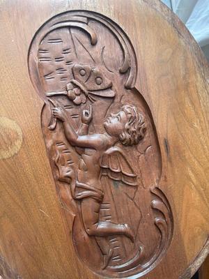 Sale Photo Thumbnail #938: Antique Glass Top Tray Carved Cherub Coffee Table. Crack in wood on tray and some damage on table legs. Carving appears to be done by hand, very intricate.