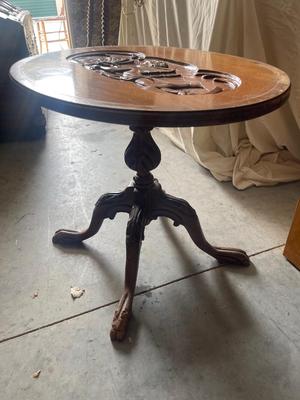 Sale Photo Thumbnail #933: Antique Glass Top Tray Carved Cherub Coffee Table. Crack in wood on tray and some damage on table legs. Carving appears to be done by hand, very intricate.