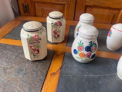 Sale Photo Thumbnail #952: Lot of Antique Salt and Pepper Shakers (Lot of 6). 3 sets, each with painted details on the sides. Removable plug in the bottom of each shaker.