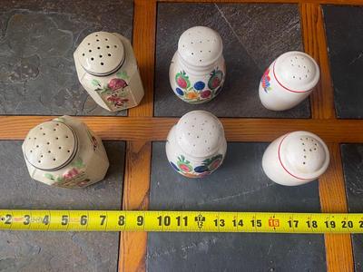 Sale Photo Thumbnail #957: Lot of Antique Salt and Pepper Shakers (Lot of 6). 3 sets, each with painted details on the sides. Removable plug in the bottom of each shaker.