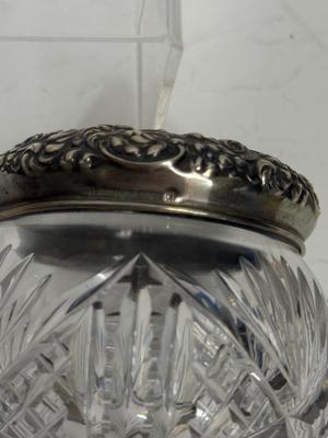 Sale Photo Thumbnail #22: Heavy, solid cut glass crystal  jar with sterling silver lid. Lid has a small dent, not very visible but can be felt, please see pictures.
Marked Sterling 925 Fine.
