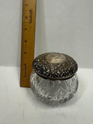 Sale Photo Thumbnail #25: Heavy, solid cut glass crystal  jar with sterling silver lid. Lid has a small dent, not very visible but can be felt, please see pictures.
Marked Sterling 925 Fine.
