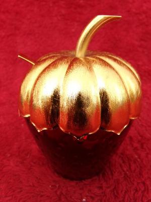 Let’s call it a sugar bowl. Looks like a strawberry w/ golden stem.
