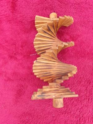 Blowin’ in the wind hanging wooden patio decor Spins in the wind.