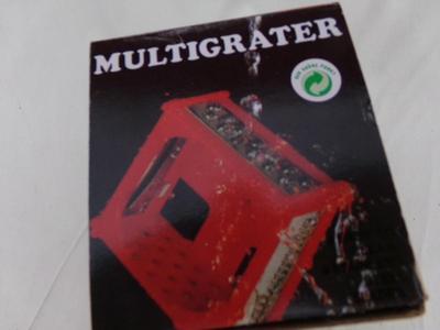 MULTIGRATER food grater-slicer-dicer do it all tool. Looks like NEW/unused in original Box.