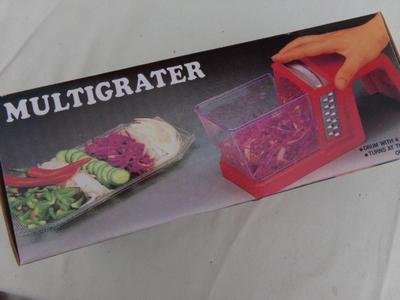 MULTIGRATER food grater-slicer-dicer do it all tool. Looks like NEW/unused in original Box.