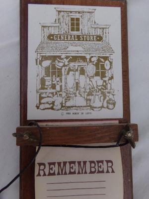 Wooden note pad board, hangs on wall or . . . about 16" tall x 4" wide.