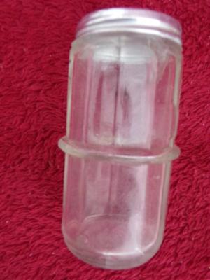 Group of 4 small spice & seasoning bottles w/twist-on lids.