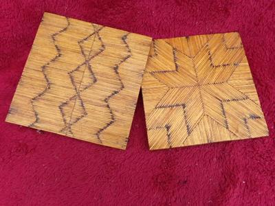 A pair of craft made trivets. Each about 7" square. Tops made of match sticks