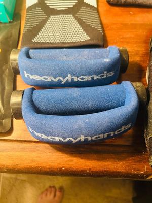 A VARIETY OF KNEE BRACES AND HAND WEIGHTS
