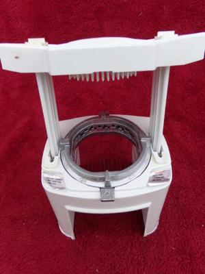 It’s the real deal, a GENUINE VEG-O-MATIC. It slice, it dices, it . . .